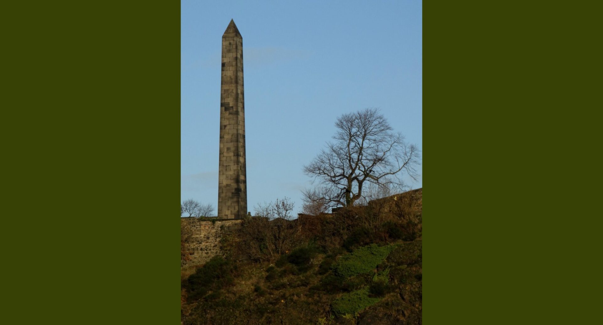 Martyrs' Monument on Calton Hill against a blue sky