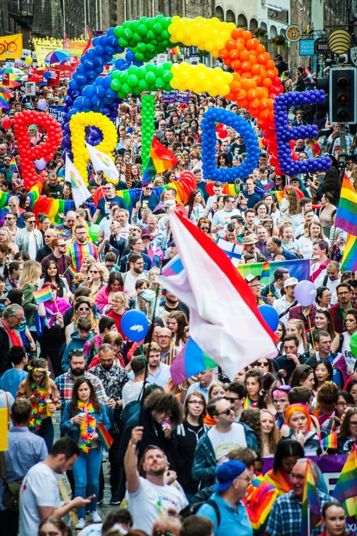 People taking part in the Pride March on the Royal Mile