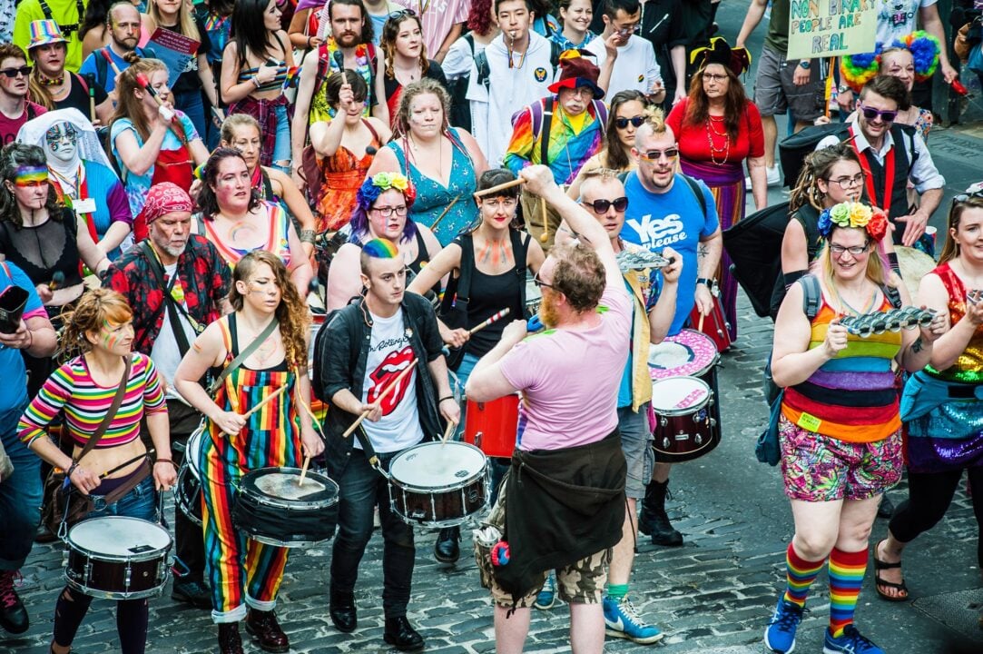 People playing drums during the Pride March