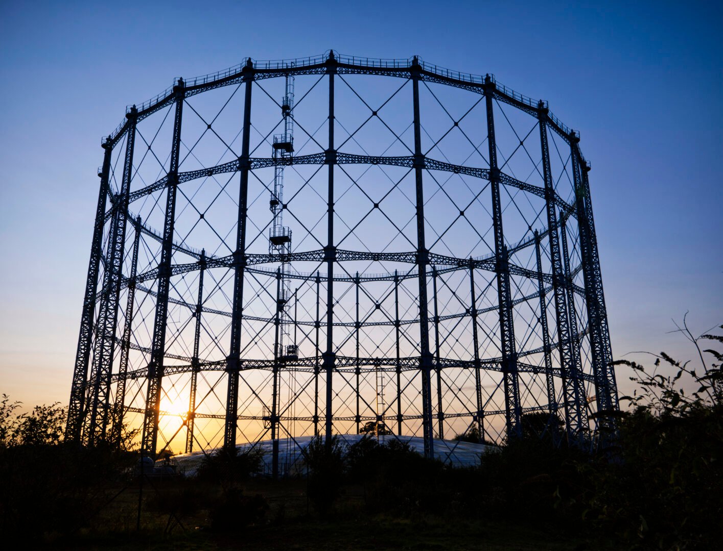 A large, empty gasometer (gas storage structure) in Edinburgh, Scotland.