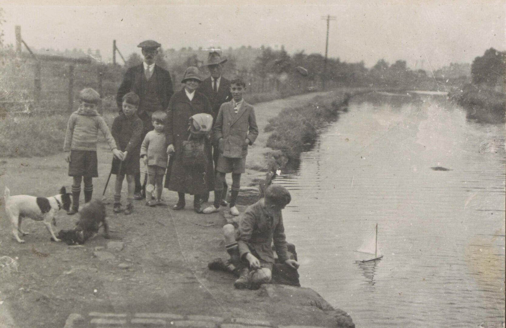 A group of adults and children taken next to the banks of the Union Canal