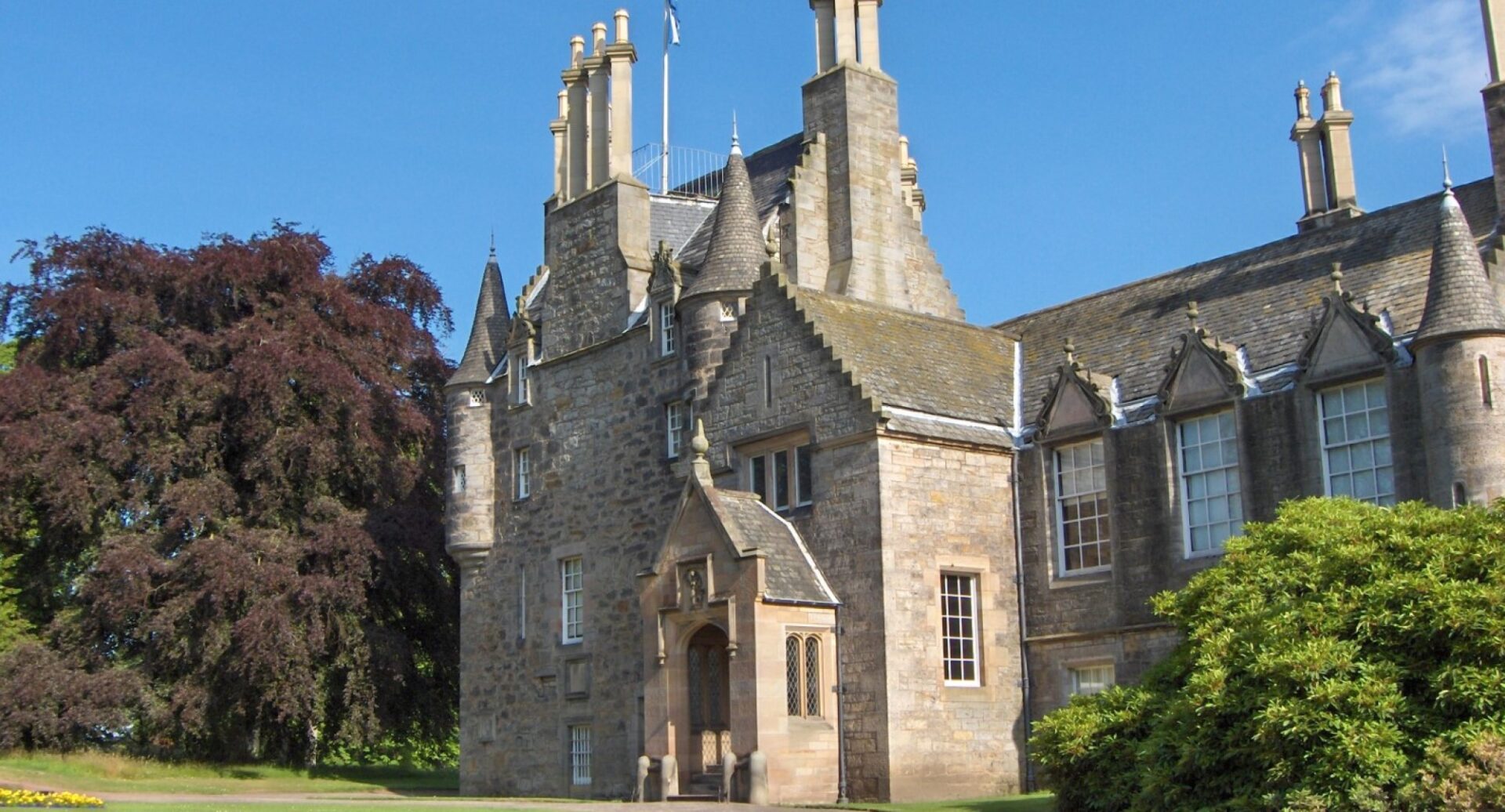 Shot of the entrance to Lauriston Castle against a blue sky