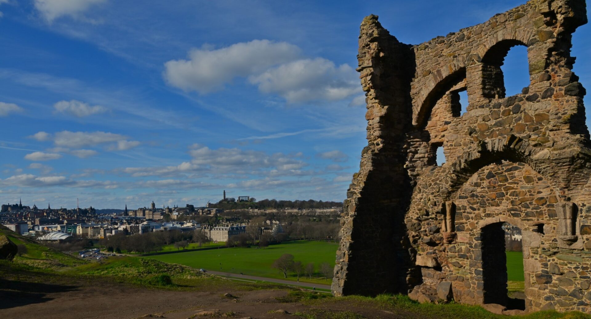 A view of the ruins of St Anthony's Chapel on the lower slopes of Arthur's Seat, with Edinburgh in the background