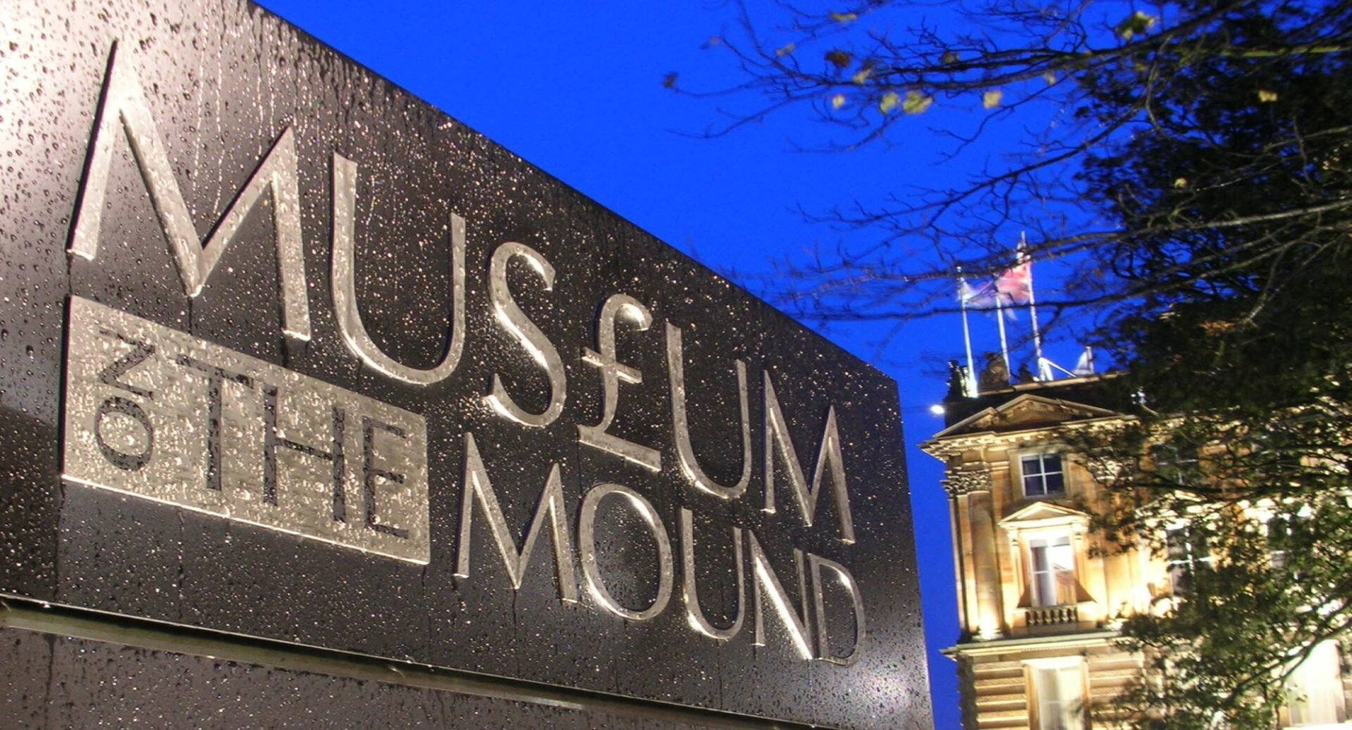 The Museum on the Mound entrance sign with the building in the background