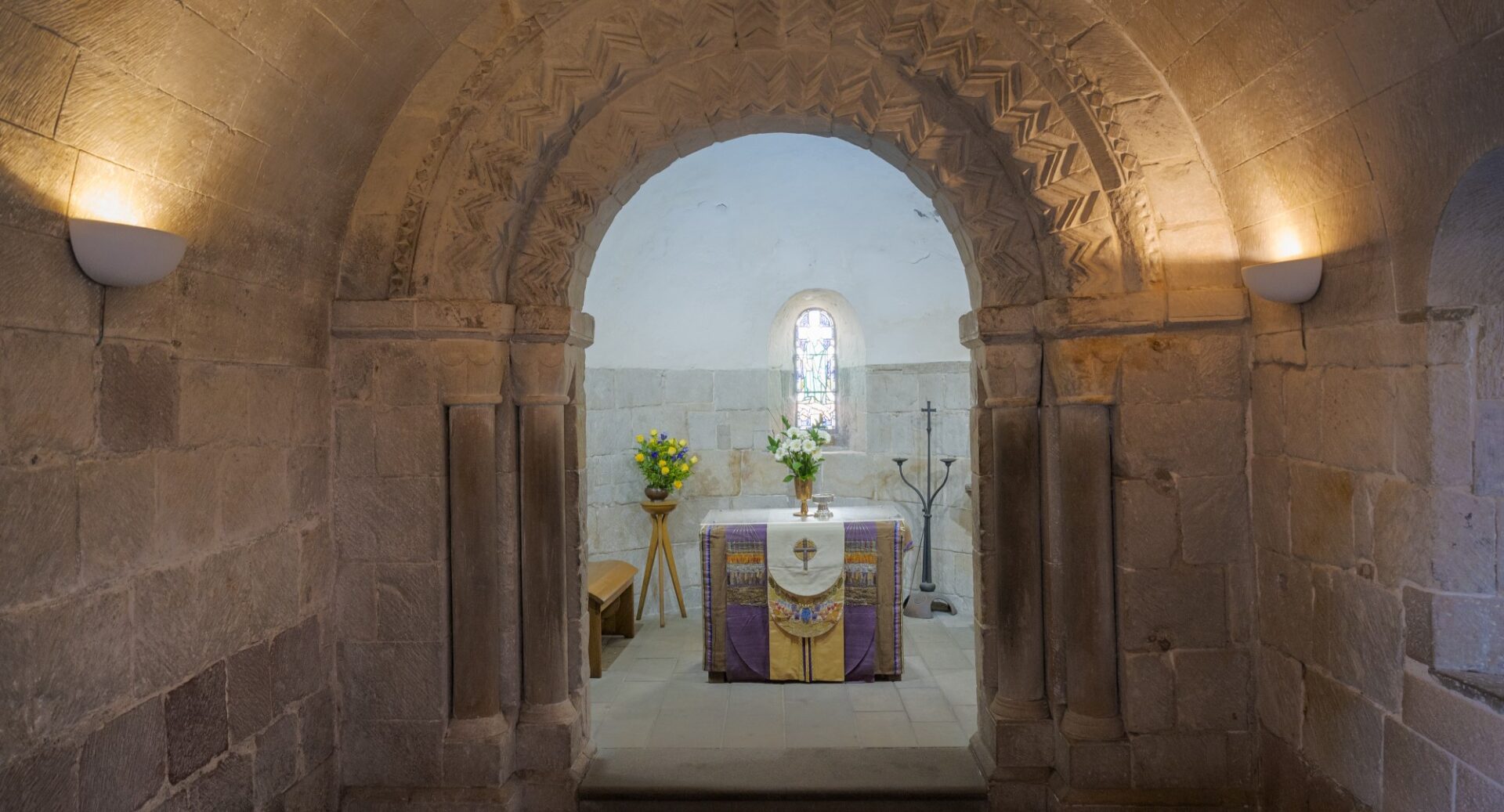 The stone corridor leading to St Margaret's chapel, with the chapel visible at the end