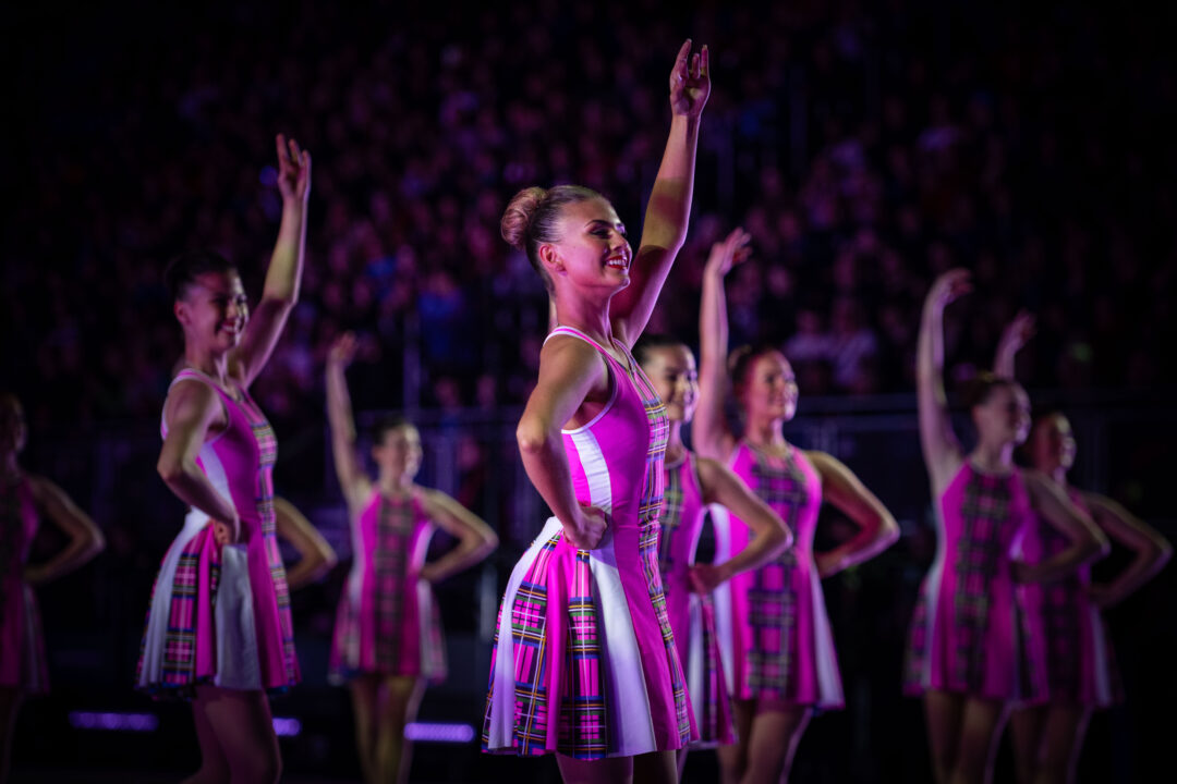 Tattoo dancers in pink dresses.