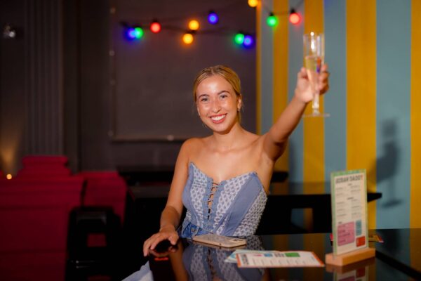 Lady holding a glass of champagne