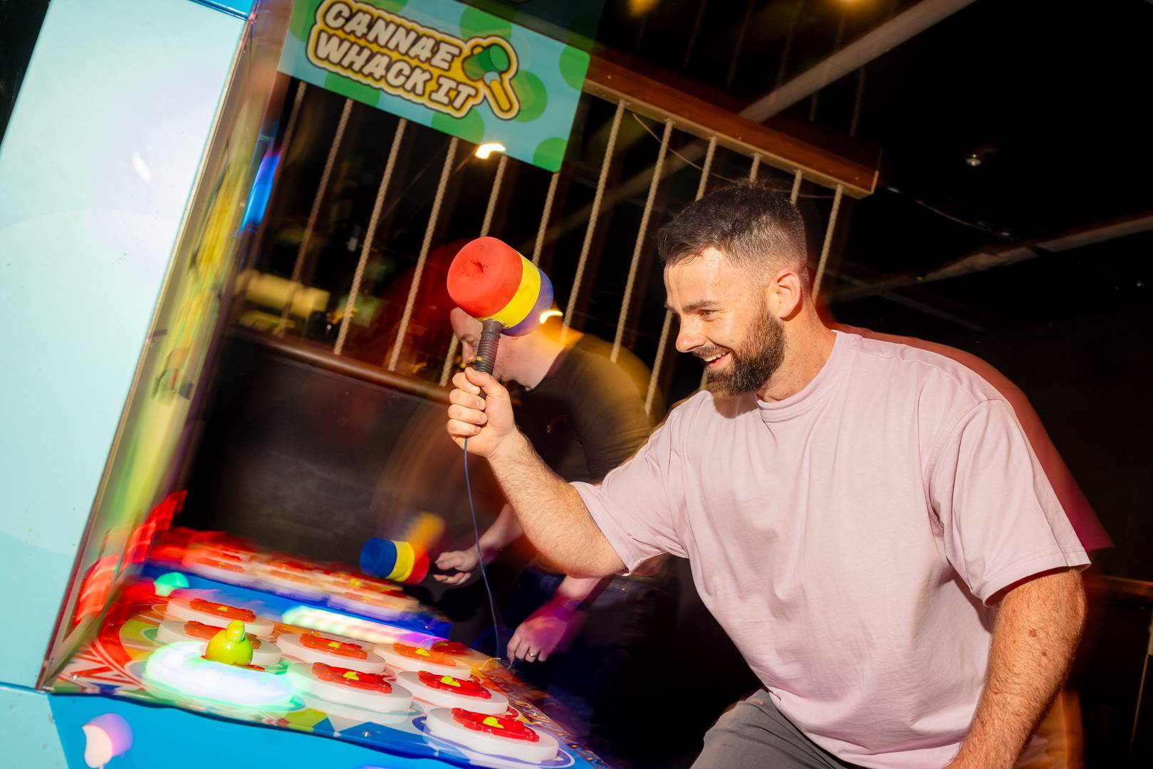 Man playing Fairground game at Fayre Play