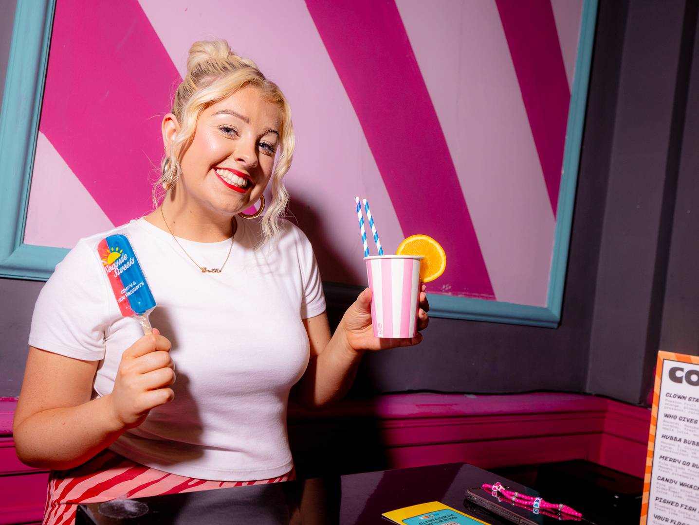 Lady holding drink at Fayre Play