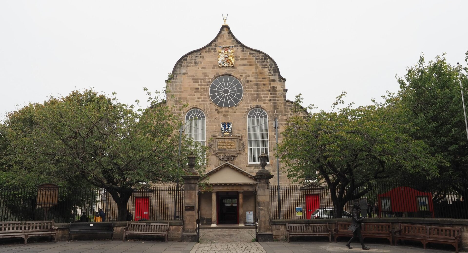 A shot from the Canongate of the front of the Kirk, with the entrance bordered by trees