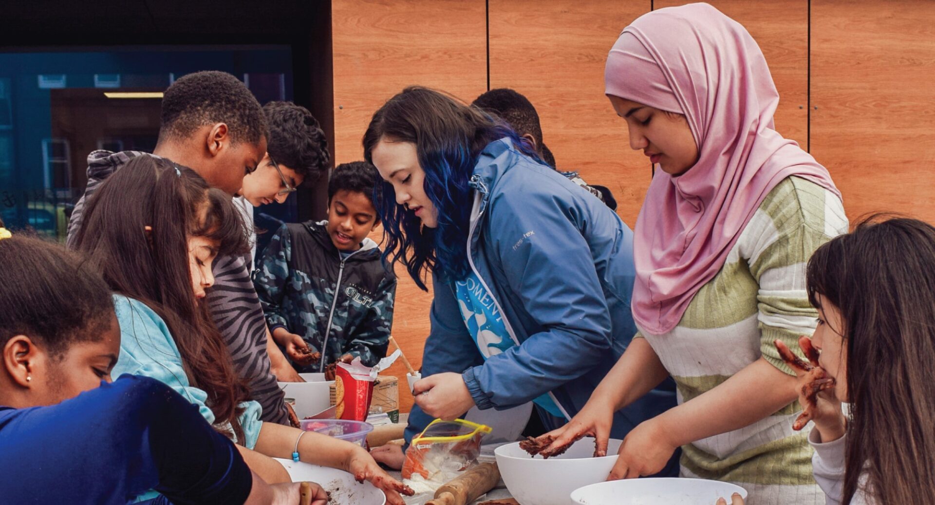 A youth activity showing a group of young people baking