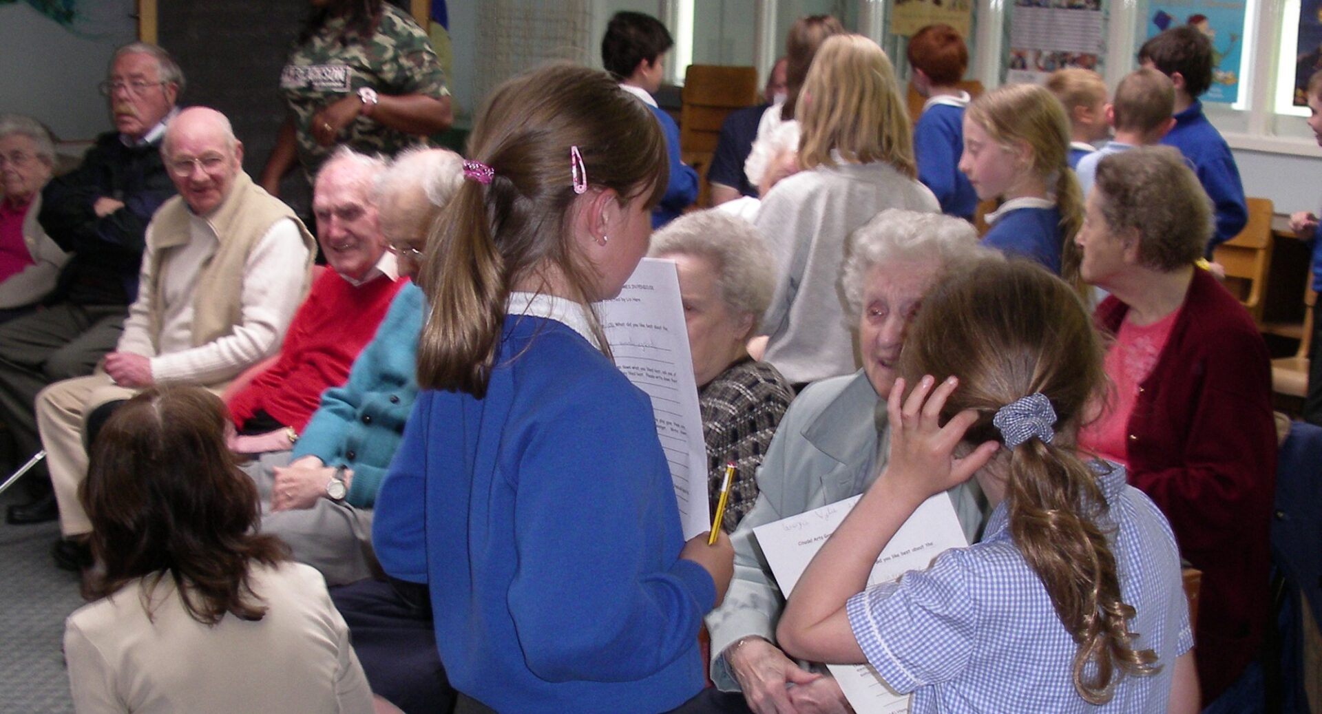 A group of school children at Cornbank Primary School discussing a show with older audience members