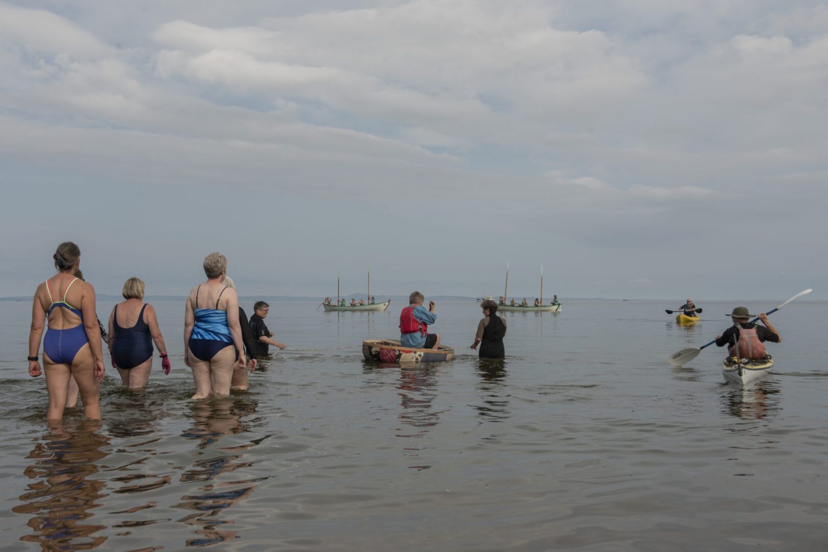 Swimmers and canoers in sea at Portobello during Art Walk Porty