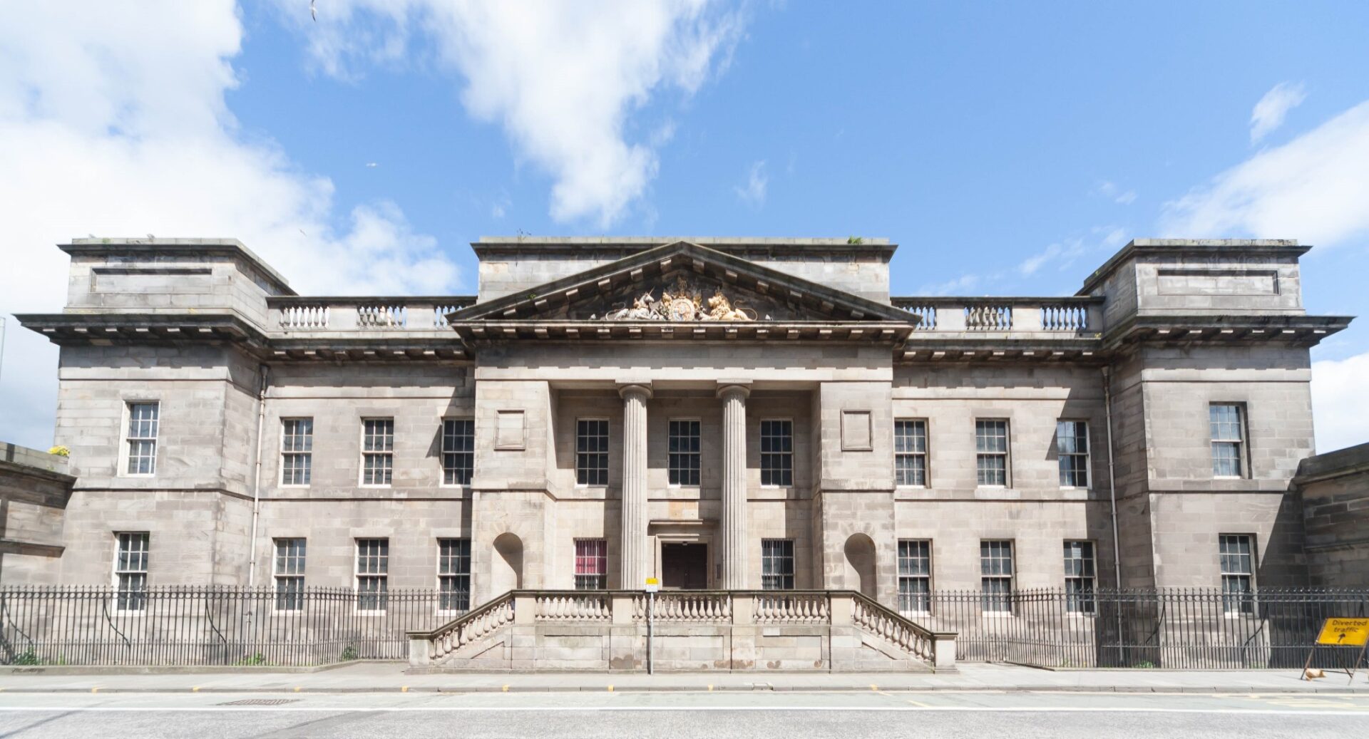 An exterior shot of Leith Custom House against a blue sky