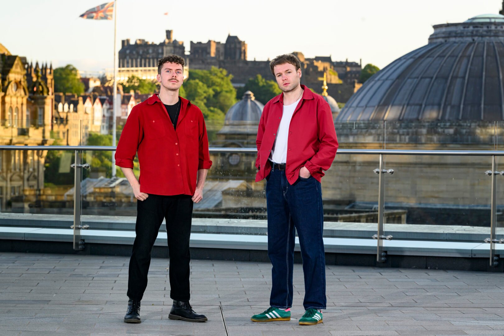 Two musicians on roof of St James Quarter