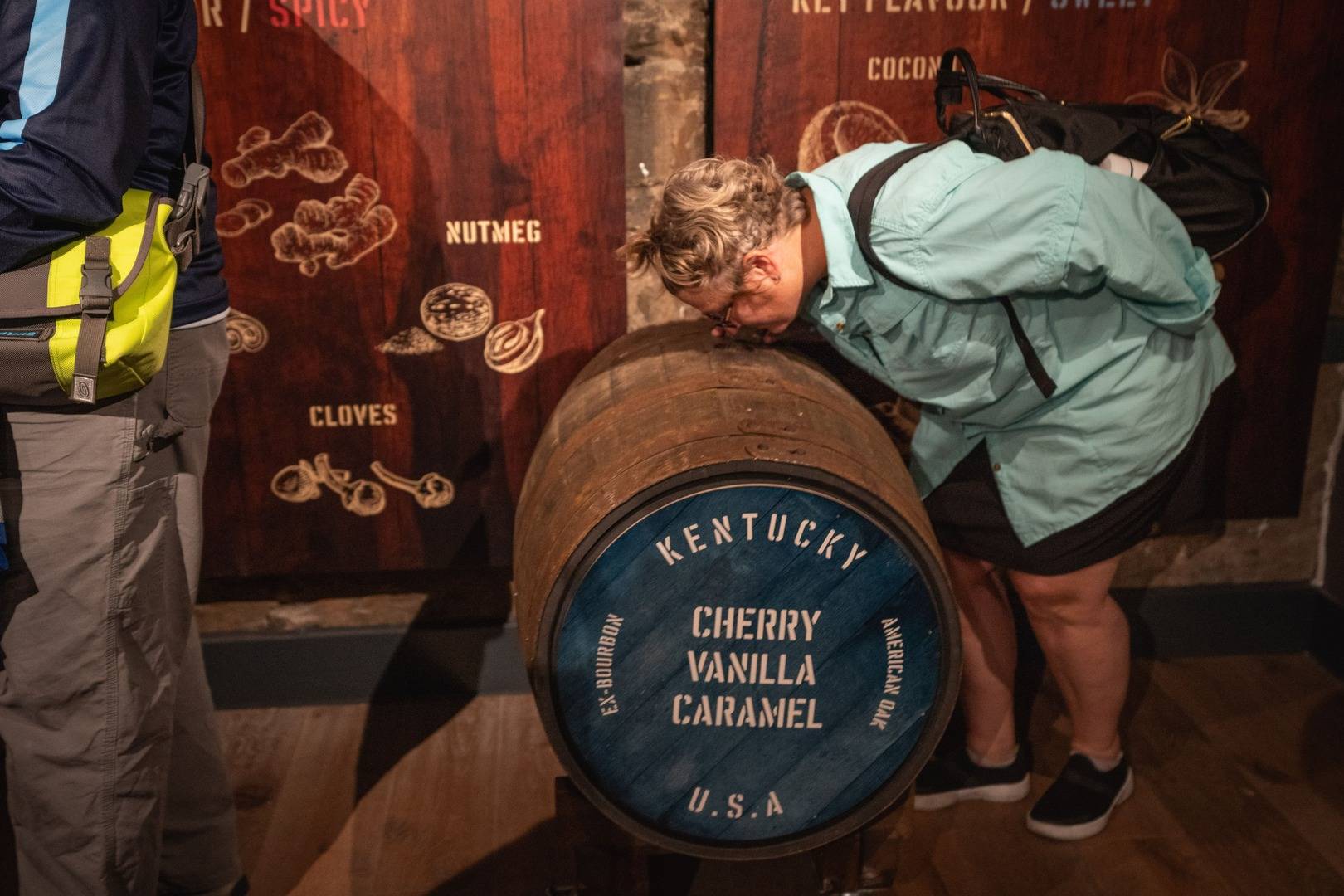 A person sniffing a whisky barrel in Edinburgh during a whisky tour,© Once Upon a Whisky