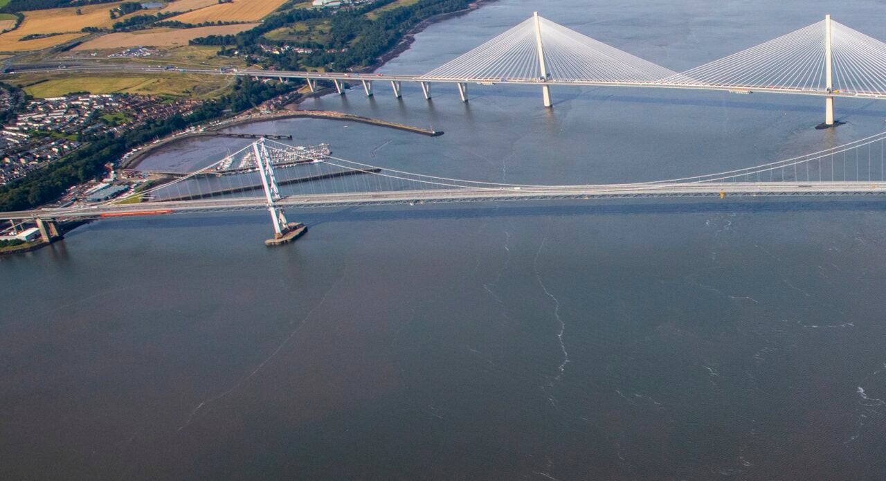 Forth Road Bridge with Queensferry Crossing in background