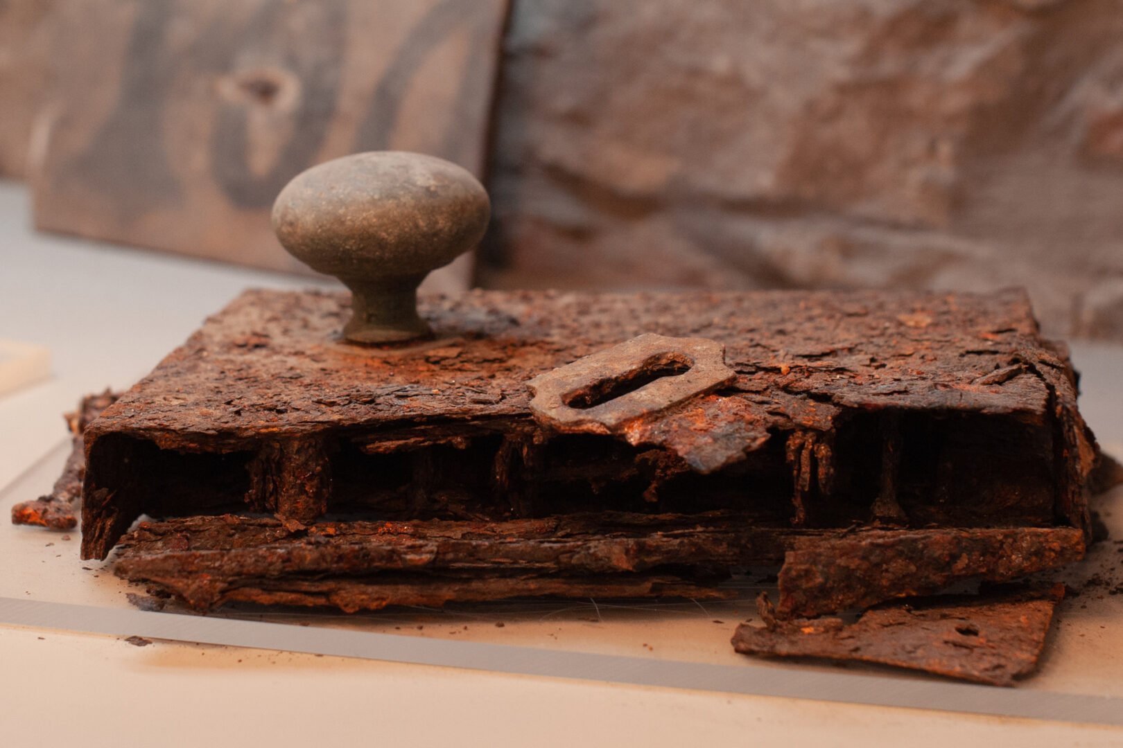 Part of a door and handle, corroded with age.