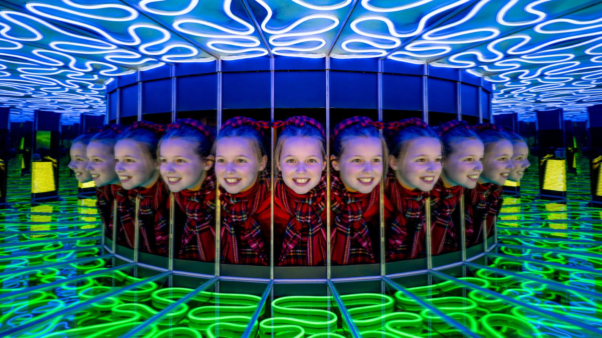 Girl's face in a mirror illusion.