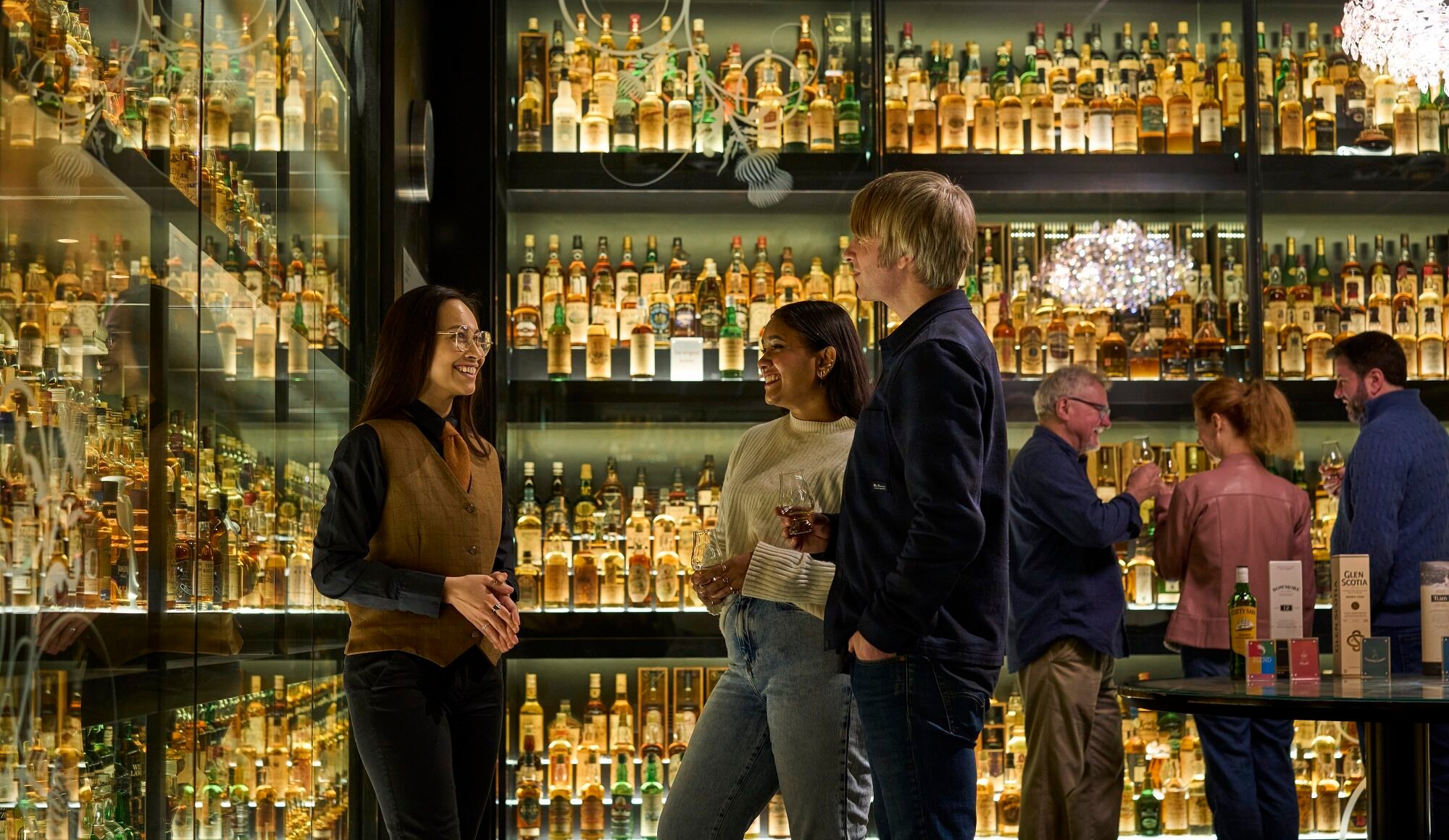 Whisky collection being viewed by guide and visitors at the Scotch Whisky Experience