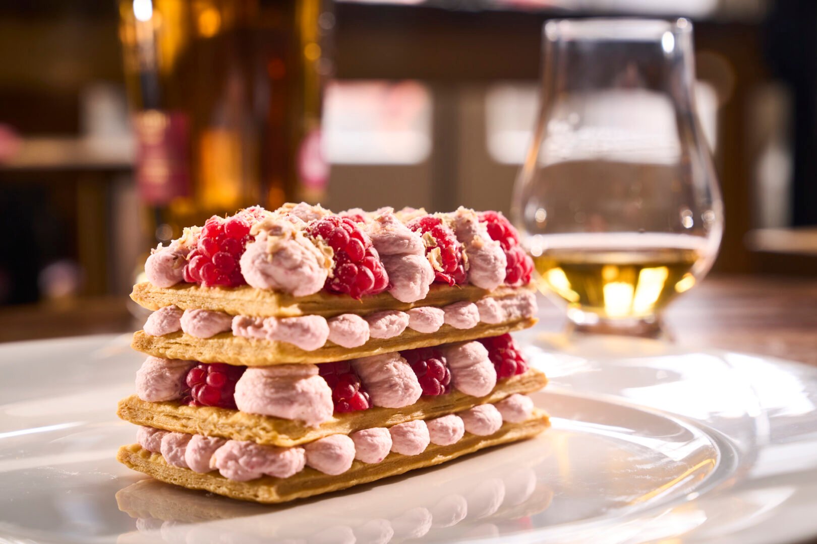 Raspberry cranachan dessert with glass of whisky at the Scotch Whisky Experience