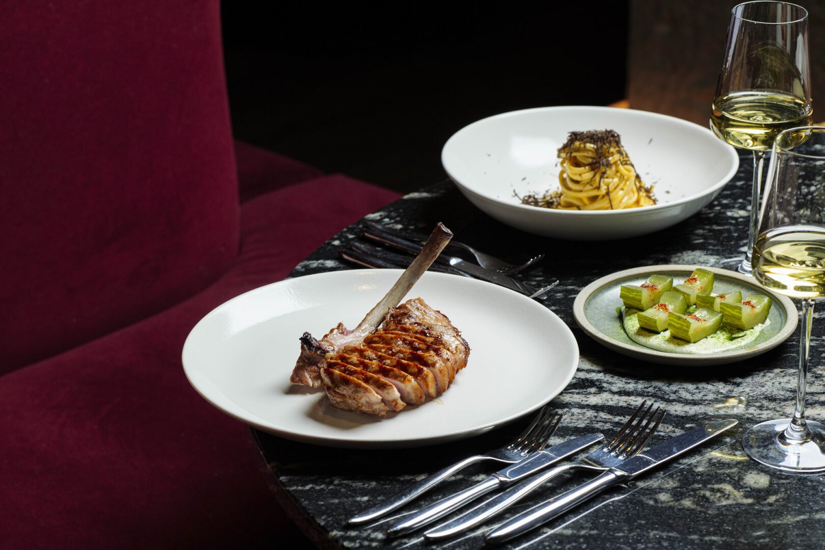 3 plates of food from the a la carte menu on a dining table at the Commons Club