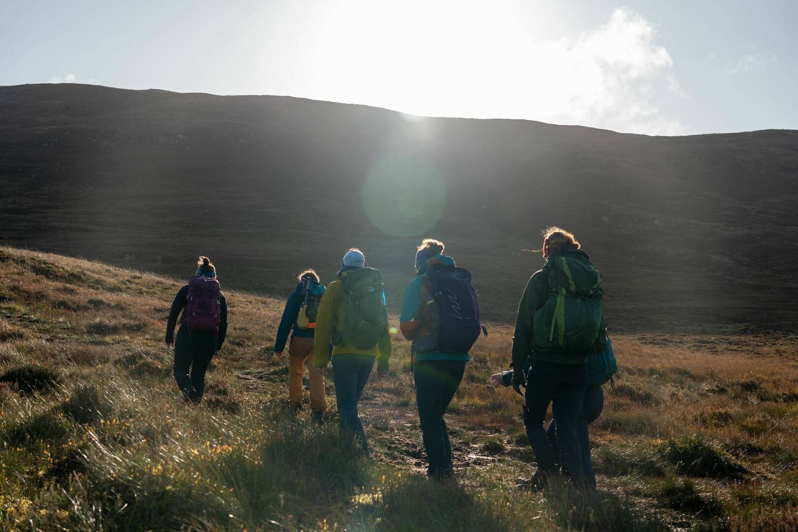 People being led on guided tour in Holyrood Park