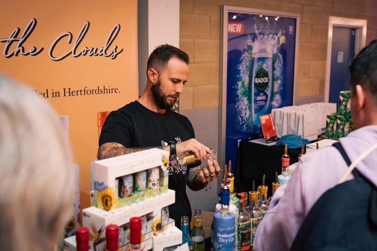 Stallholder pouring sample of gin at the Gin and Rum Festival