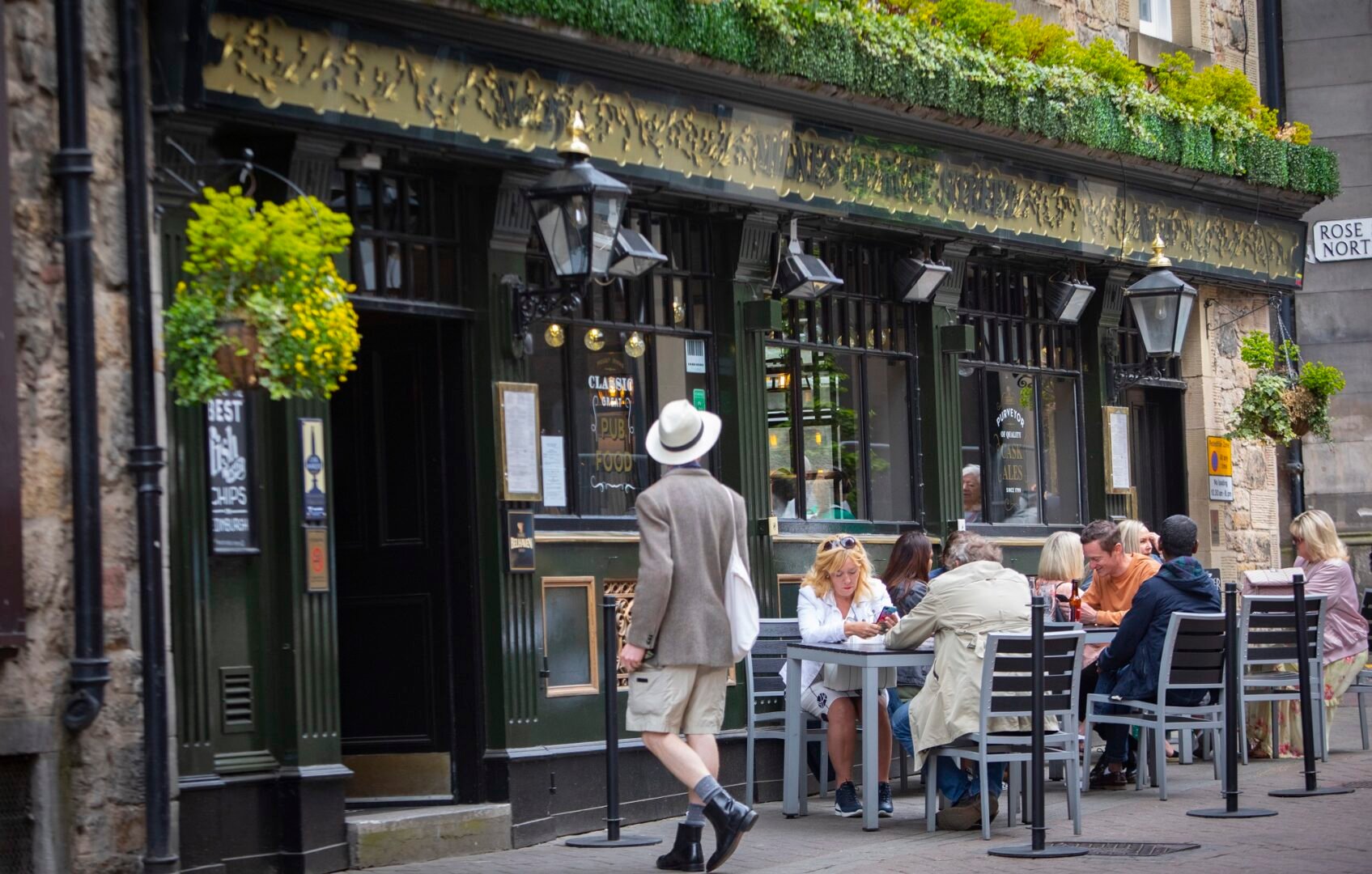 People sitting outside Milnes Bar on Rose Street