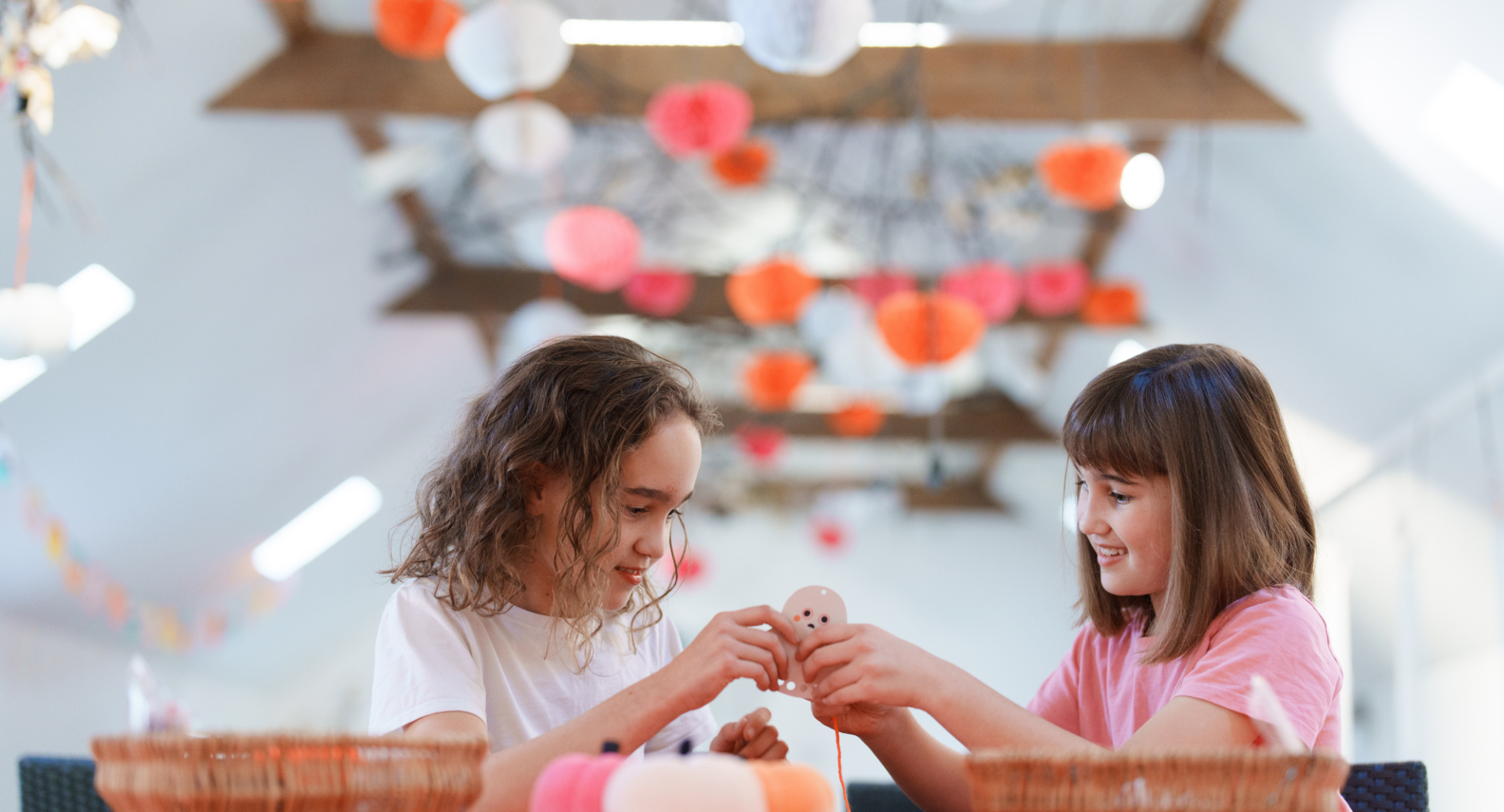 Two girls taking part in Halloween craft activities at Dalkeith Country Park