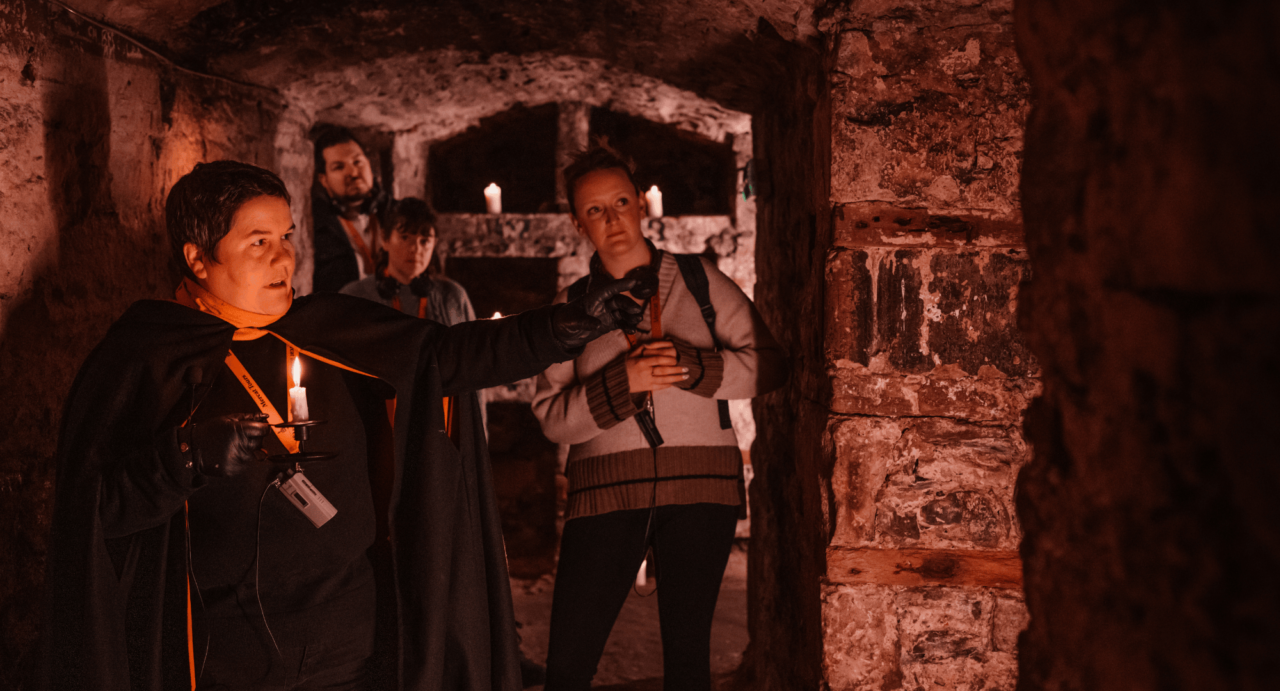 Tour guide leading participants around the Blair Street Vaults