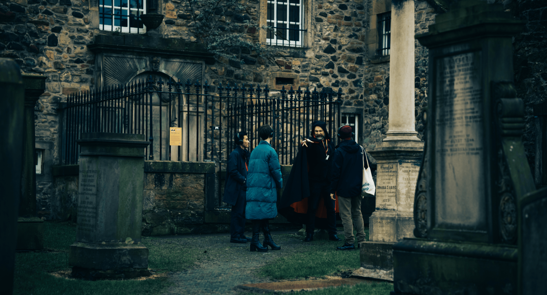 Tour Guide with Tour participants in the grounds of Canongate Graveyard