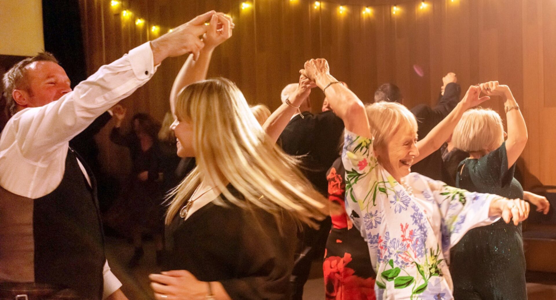 People taking part in ceilidh dancing