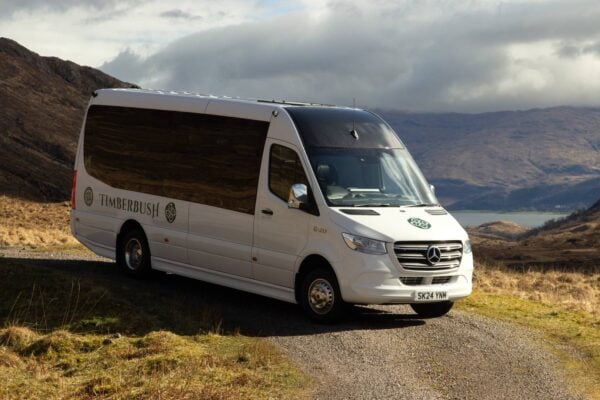 Timberbush coach with the dramatic backdrop of the Scottish Highlands