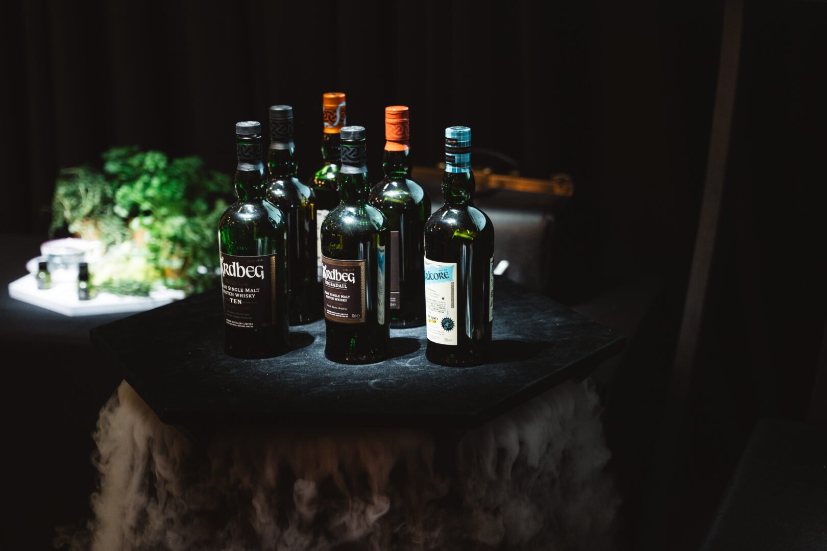 Table with bottles of whisky.