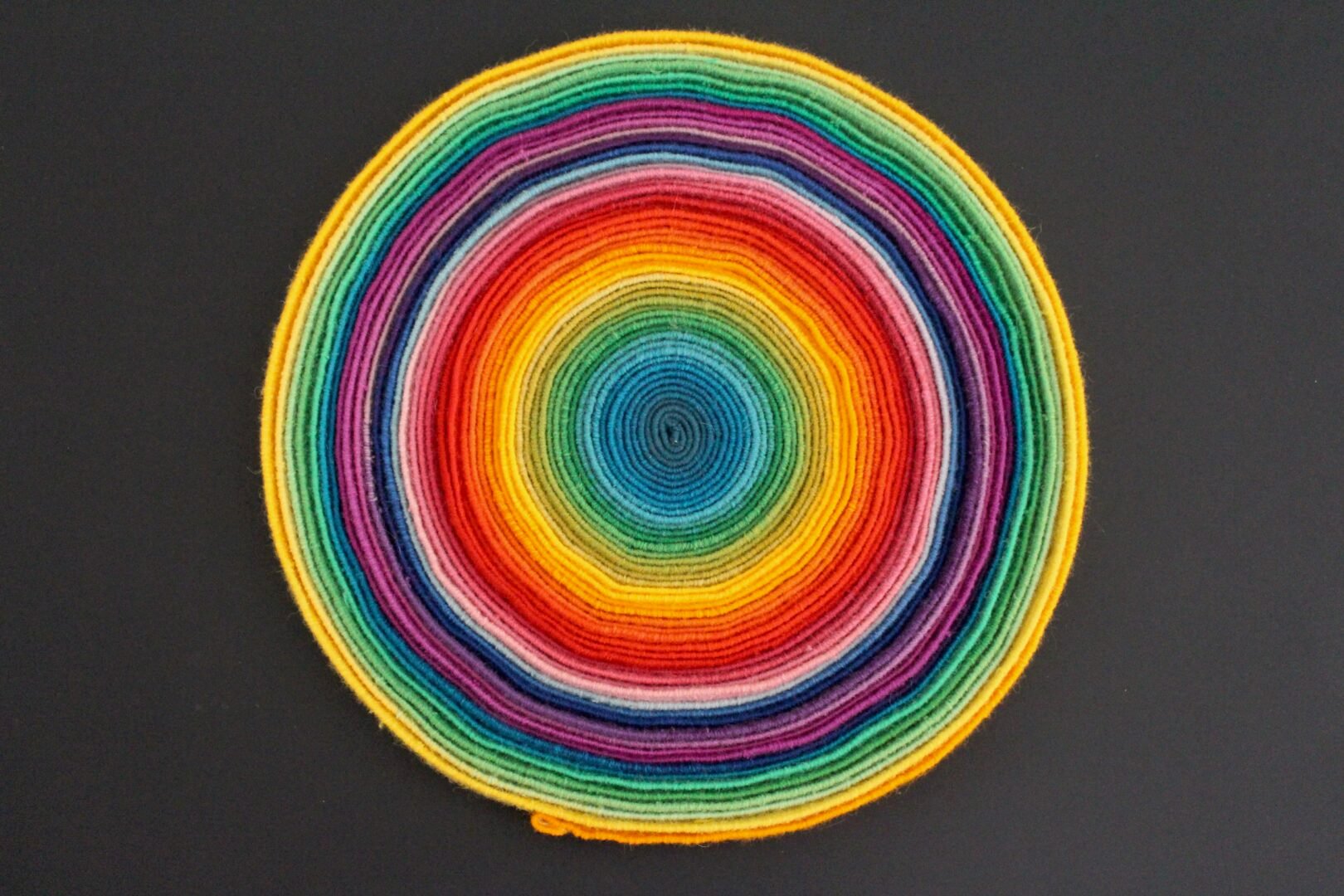 Circle comprising different coloured threads.