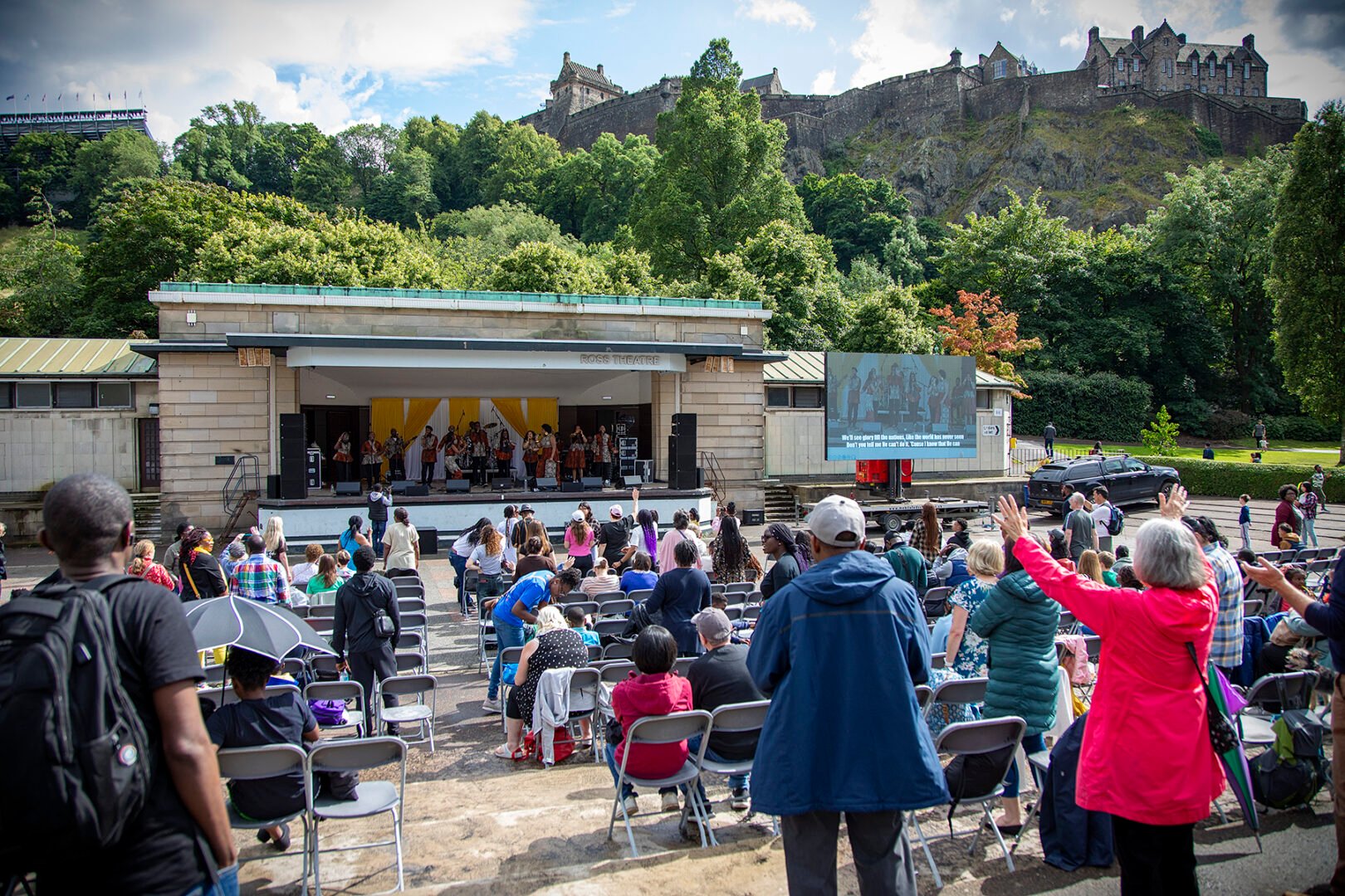 A shot of the Ross Bandstand with the crowd seated in front