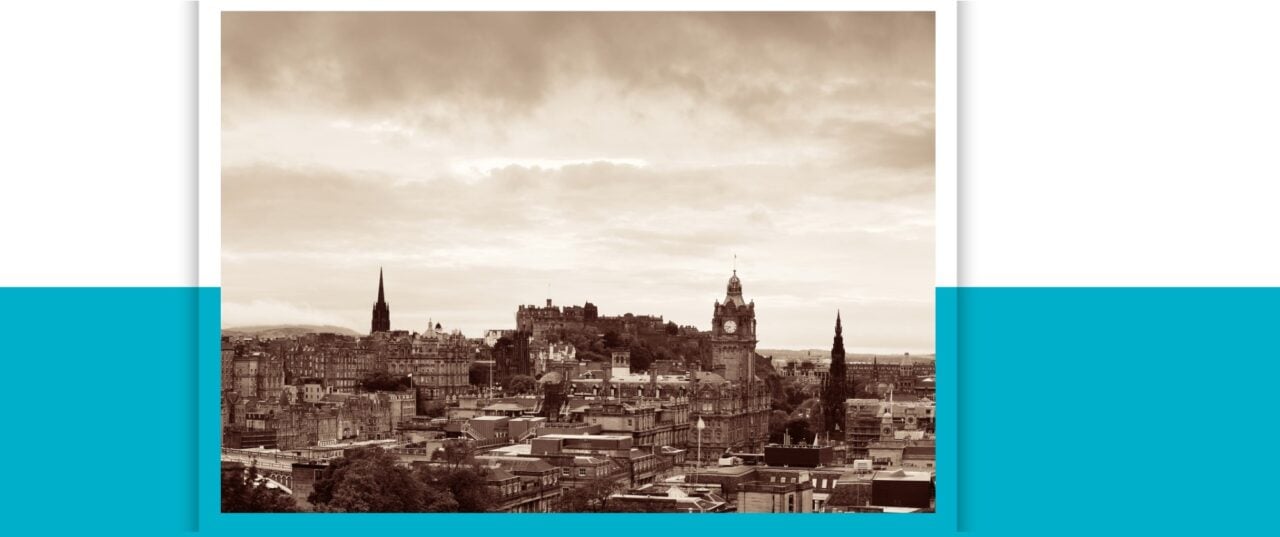 A sepia photo of an Edinburgh cityscape from the east, showing the castle, Scott Monument, and St Giles among other buildings in the Old Town