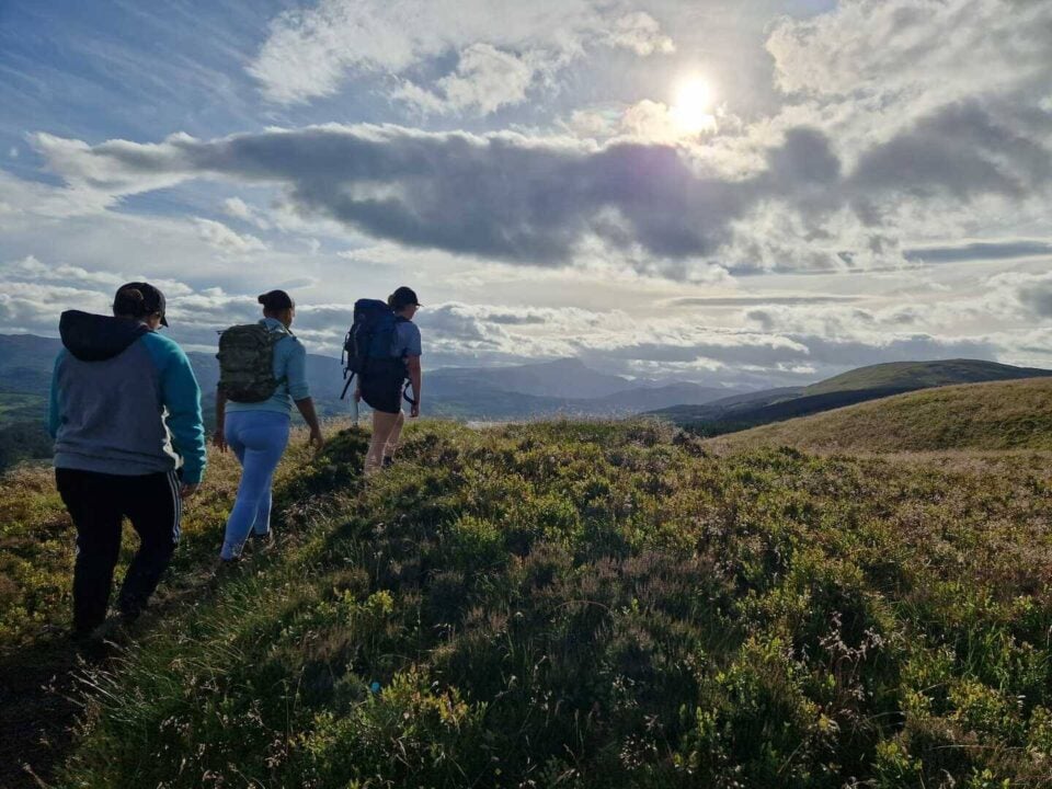 3 people hiking