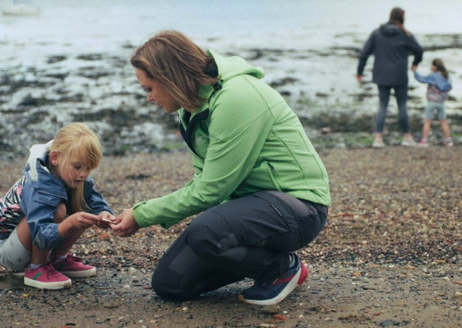 tour guide showing shells on the beach