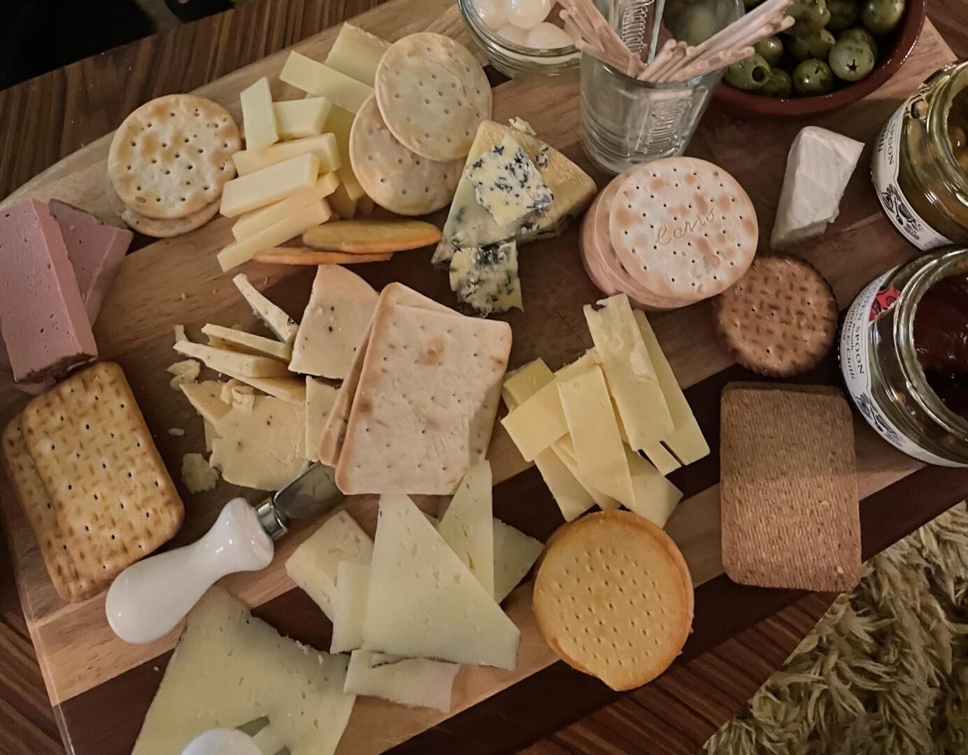 Platter with a variety of crackers and cheese.