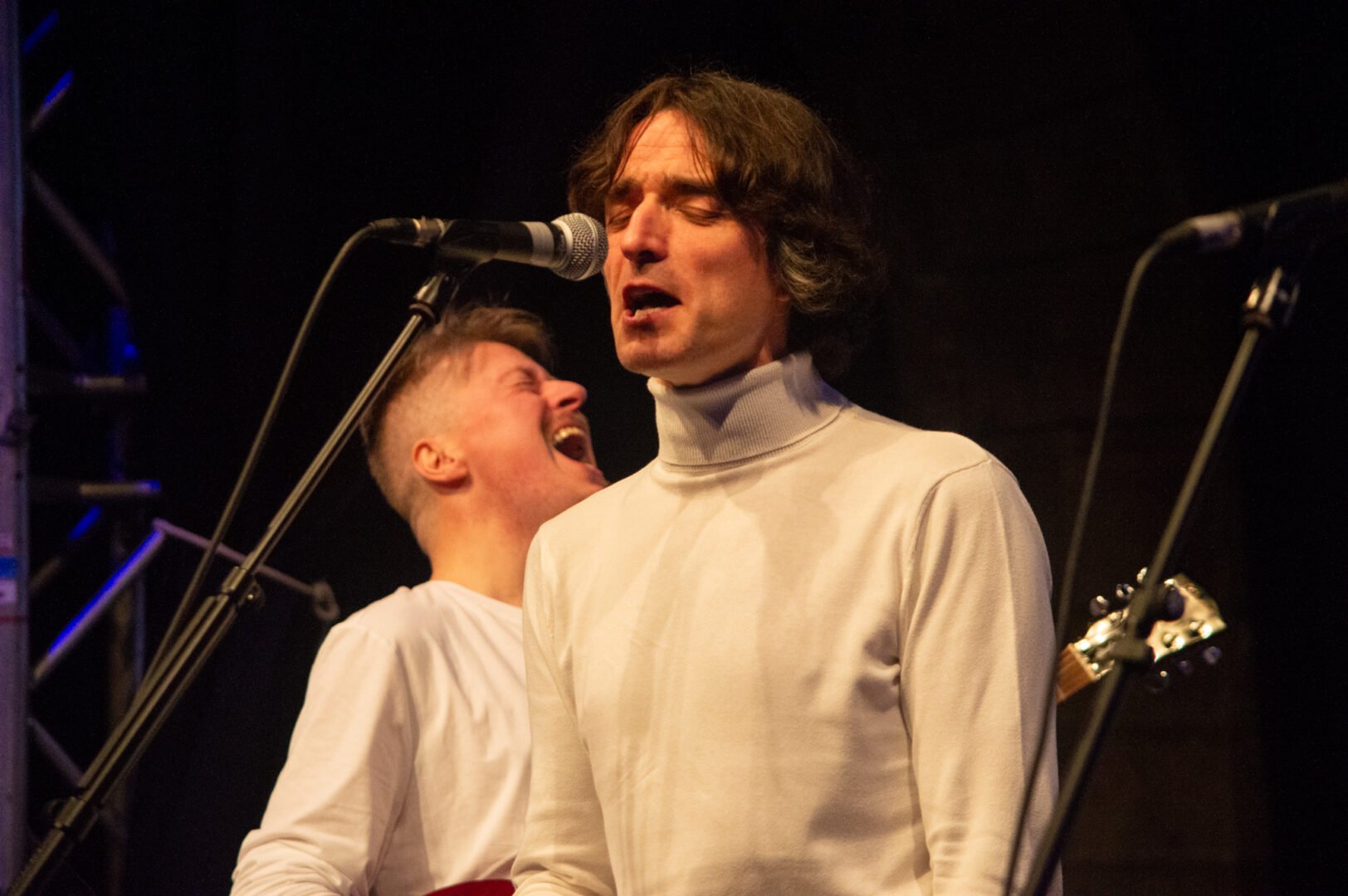 Man singing into a microphone at the Beatles Marathon UK