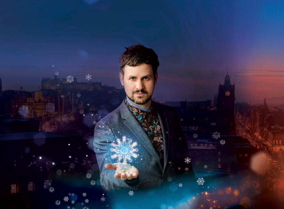 Poster image of man holding a snowflake in his hand, against a background of a city skyline.