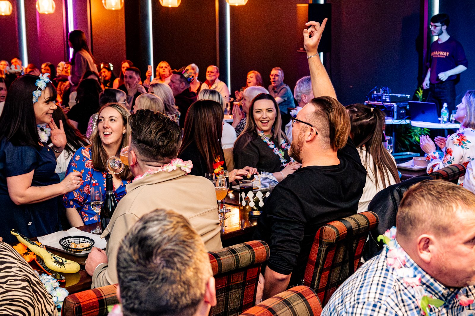 People sitting down at tables at an event