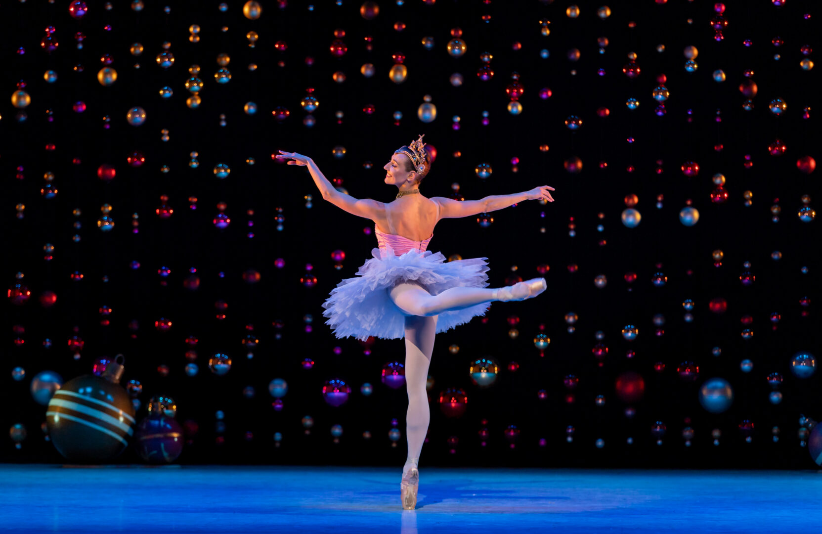 Ballerina dancer in tutu dancing on stage.