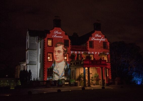 Robert Burns image projected on to Prestonfield House