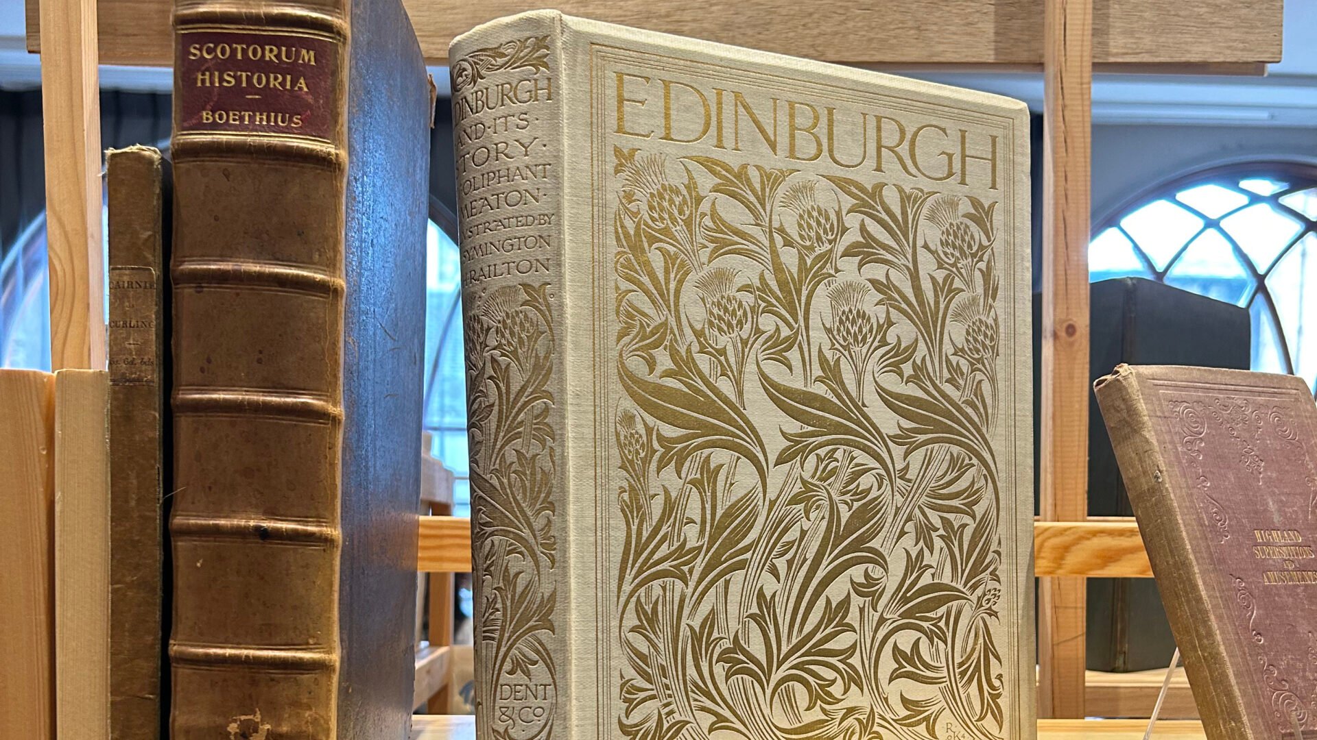 A selection of books sitting on a shelf. book shelf.