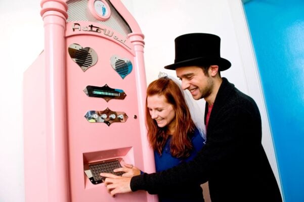 Novelty wedding vending machine called Auto Wed with Bride and Groom at Camera Obscura