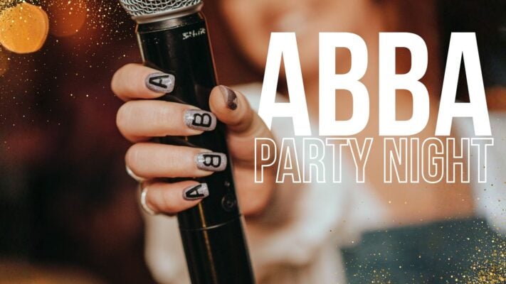 Hand holding a microphone with the word ABBA Party Night added on top of the image.