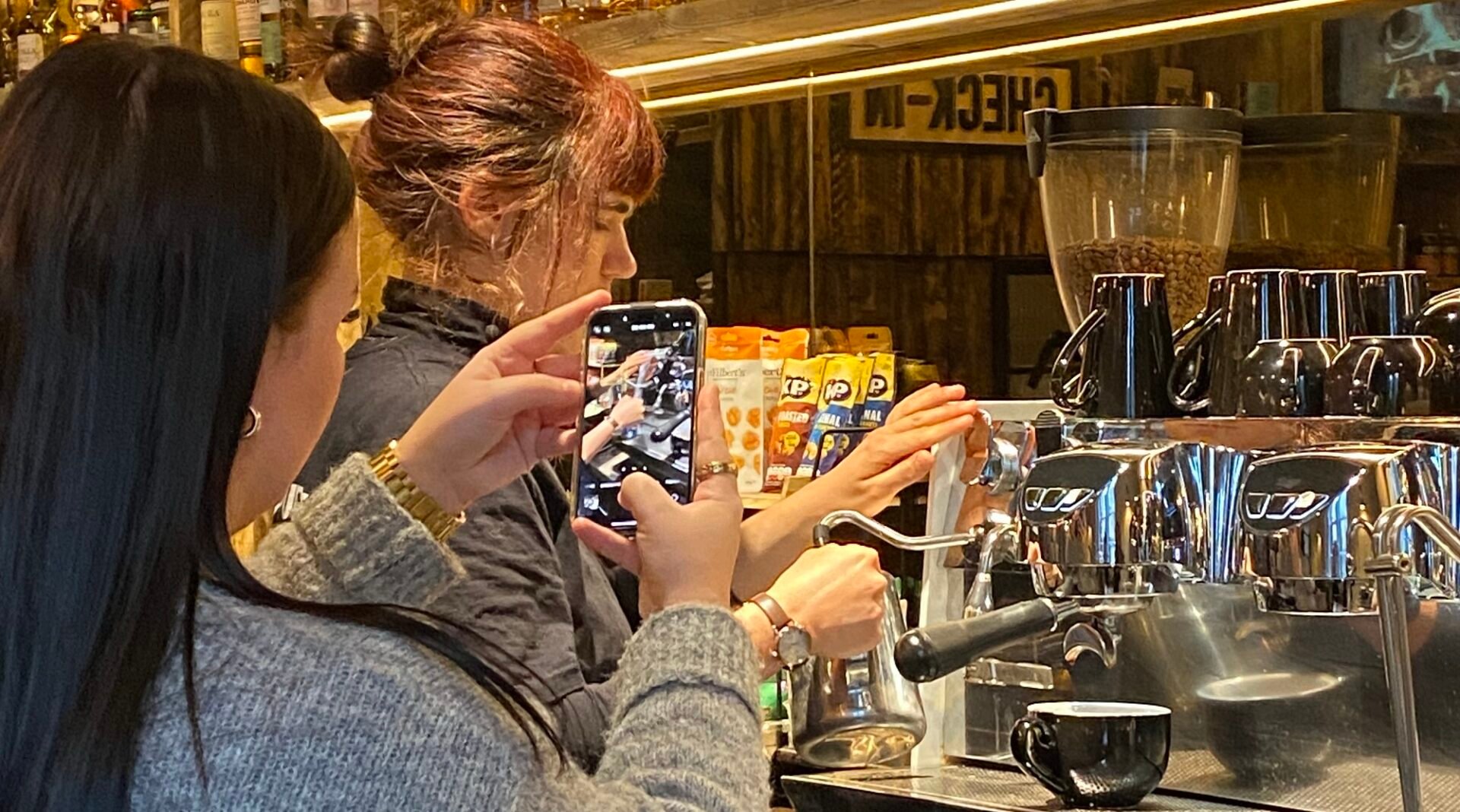 Person filming Barista making coffee